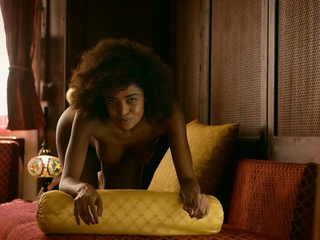 Curly ebony model shows perfect body